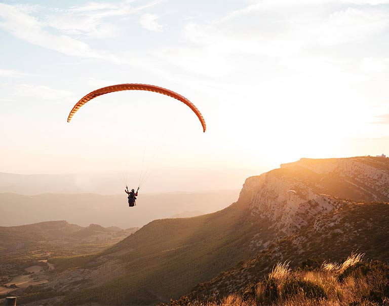 A person paragliding A person paragliding